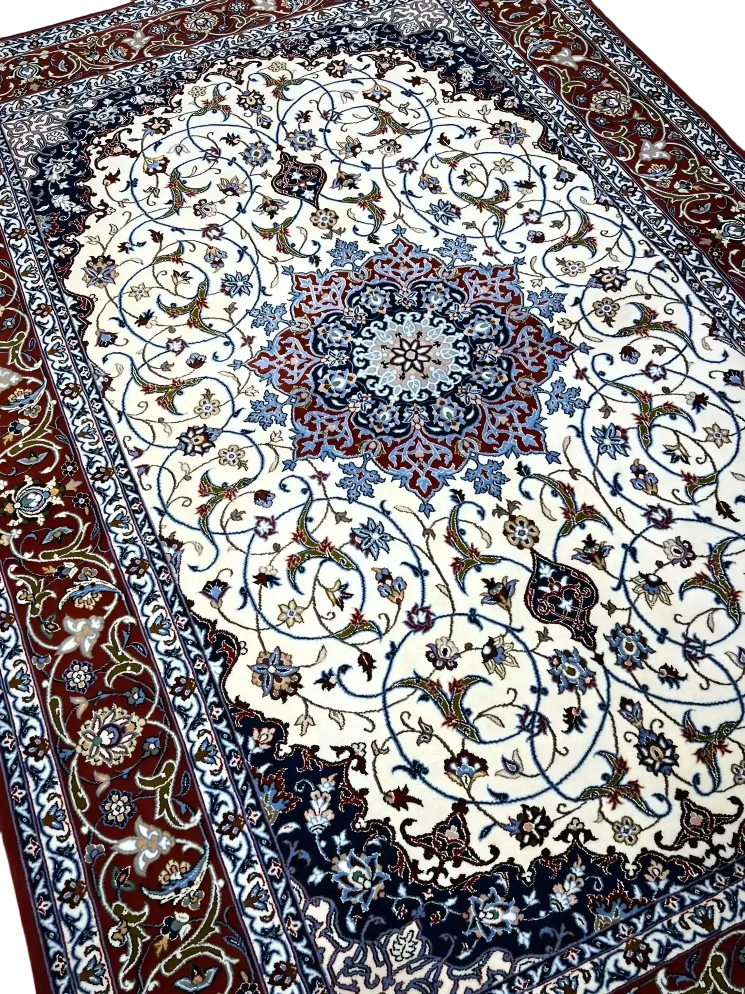 "Close-up of hand-knotted Isfahan carpet showcasing intricate floral motifs."